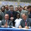 Mayor Michael Bloomberg with Governor George Pataki as he is given control over the NYC public schools, at PS 171 in Harlem June 2002	