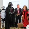 Cass Sunstein posing with Harvard students dressed as “Star Wars” characters after a lecture