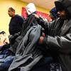 Raulo Jeffers (right), 55, at the annual coat drive at the New York City Rescue Mission in Chinatown on Christmas Day 2013.