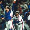 Gary Carter #8 and Wally Backman #6 of New York Mets celebrate after winning the 1986 Major League Baseball World Series