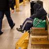 Homeless woman in Lower Manhattan subway station.