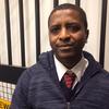 Gerald Michaud, a TPS recipient from Haiti, works as a wheelchair agent at LaGuardia Airport.