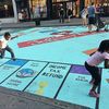 Kids enjoying a Monopoly board mural in Jersey City before it was painted over.
