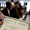 Newest Americans at naturalization ceremony for immigrants to America in New York City.