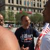 A demonstrator near convention headquarters in downtown Cleveland sports a 'Hillary for Prison' shirt. 