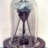 Picture of the Pitch Drop Experiment at the University of Queensland, with 9-volt battery for size comparison