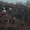 Crews repairing tracks in the Bronx on Tuesday, Dec. 3, 2013,  at the site of Sunday's Metro-North fatal train derailment.