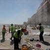 Workers repairing the boardwalk at 116th Street in Rockaway Beach 6 months after Sandy.