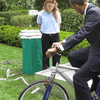 President Obama using a bike-powered water sanitation system at the White House Science Fair