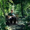 New York's brightly lit 6th & B Community Garden, with its lush greenery and mellow wildlife, provides just the right setting for Bill Callahan.