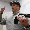 Gun instructor Mike Stilwell demonstrates a revolver as he teaches a packed class to obtain the Utah concealed gun carry permit, at Range Master of Utah, on January 9, 2016 in Springville, Utah.