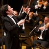 Gustavo Dudamel conducting an orchestra