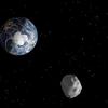 This NASA diagram depicts the passage of asteroid 2012 DA14 through the Earth-moon system on Feb. 15, 2013