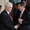 Vice President Mike Pence and National Security Adviser Michael Flynn, right, shake hands on February 10, 2017. 