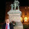 Fred Plotkin at the Verdi statue on the Piazza Verdi in Busseto