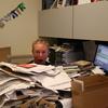 Soundcheck host John Schaefer, buried under a pile of CDs and press releases.