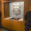 Two police officers stand guard over the recovered 300-year-old Stradivarius violin that was taken from the Milwaukee Symphony Orchestra's concertmaster in an armed robbery last week February 6, 2014