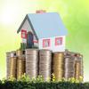 Mortgage concept by money house from coins