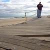 At first, Ocean Grove, N.J., failed to qualify for federal Sandy aid to repair its boardwalk. Above, a passerby surveyed the damage shortly after Sandy.