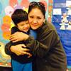 Maria Elena Zuñiga and her son Manuel have benefited from a parent involvement program at his school.