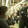 Mexico City train passengers wearing surgical masks