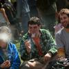  Young men smoke a marijuana cigarette during a 'smoke out' with thousands of others April 20, 2010 at the University of Colorado in Boulder, Colorado