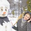 Girl with headphones and snowman