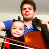 Cellist Warren Oja with his infant daughter.