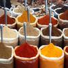 bags of spices for sale in a market