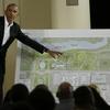 President Barack Obama with a rendering for the former president's Chicago presidential center in May, 2017.