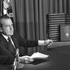 President Richard M. Nixon points to the transcripts of the White House tapes after he announced that he would turn over the transcripts to House impeachment investigators.