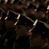 New graduates of the NYPD Police Academy participate in a graduation ceremony in New York, Wednesday, Dec. 28, 2016.
