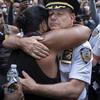 Chief of Department of the New York City Police, Terence Monahan, hugs an activist as protesters paused while walking in New York, Monday, June 1, 2020.