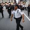 NYPD officers move in to arrest protesters for violating curfew beside the iconic Plaza Hotel on 59th Street, Wednesday, June 3, 2020.