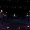 President Donald Trump and former Vice President Joe Biden speak at podiums during the presidential debate.
