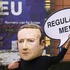 A campaigner from the global citizens movement Avaaz wearing a mask of Facebook CEO Mark Zuckerberg holds a sign reading 'Regulate me' on Tuesday, Dec. 15, 2020 in Brussels.