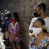 Seniors wait in line to get the Sinovac vaccine for COVID-19 at a health center in Brasilia, Brazil, Monday, March 29, 2021.