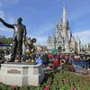 A statue of Walt Disney and Micky Mouse stands in front of the Cinderella Castle at the Magic Kingdom at Walt Disney World in Lake Buena Vista, Fla.