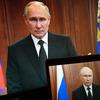 Russian President Vladimir Putin is seen on monitors as he addresses the nation after Yevgeny Prigozhin, the owner of the Wagner Group military company, called for armed rebellion.
