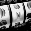 A black and white image of the rotary dials on a slot machine.