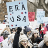 demonstrators holding signs in support of the Equal Rights Amendment 