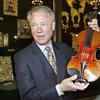 Dietmar Machold holds a 1708 Stradivarius violin in 2003
