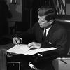 President Kennedy signs the Proclamation for Interdiction of the Delivery of Offensive Weapons to Cuba on Oct. 23, 1962.