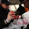 A man receives food from volunteers handing out lunch to residents in the heavily damaged Rockaway neighborhood.