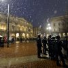 Riot policemen stand as guests arrive for the opening show of the season of La Scala opera house on Dec. 7, 2012 in Milan