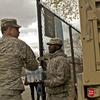 Members of the National Guard unload food and water for distribution at Cofey Park in Red Hook, Brooklyn Friday.
