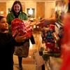 Jose Criespo, 10, receiving a gift from the relief group Secret Sandy at a holiday party on December 23, 2012.