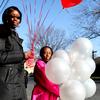 Abina Johnson, 51, of Far Rockaway picking up balloons with her daughter for a holiday party at her home, which is still without heat after Sandy.