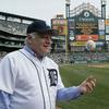 Detroit Symphony Music Director Leonard Slatkin throws out the first pitch at a Detroit Tigers game in October 2011.