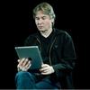 Conductor Esa-Pekka Salonen looks at his app, The Orchestra